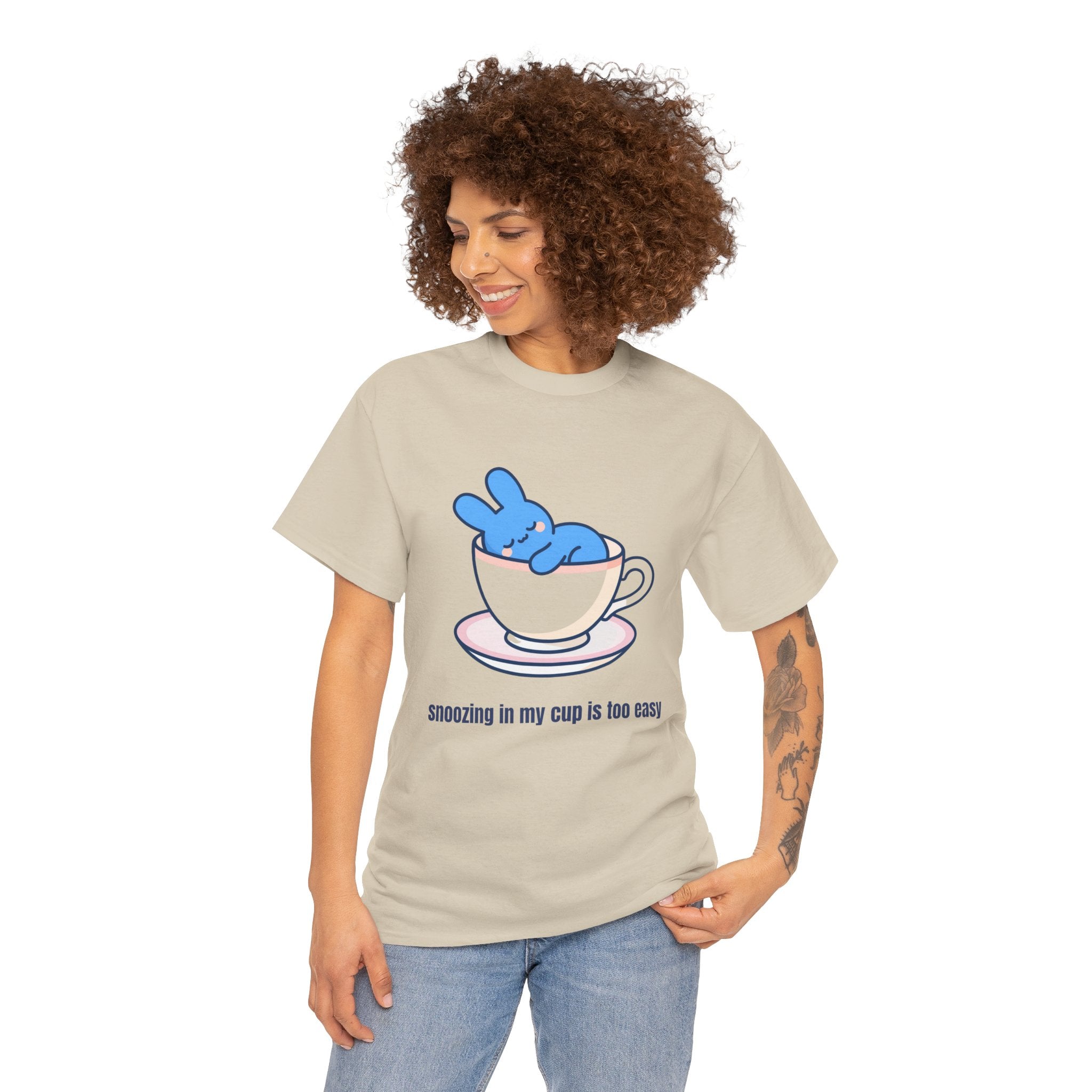 Cute Bunny Tea Tee — "Snoozing in My Cup is Too Easy" Graphic T-Shirt - Steep Dreams – Why sit beside a cup when you can sleep IN one? 😴☕ Our little blue bunny has found the cosiest nap spot imaginable — and honestly, we're jealous. S