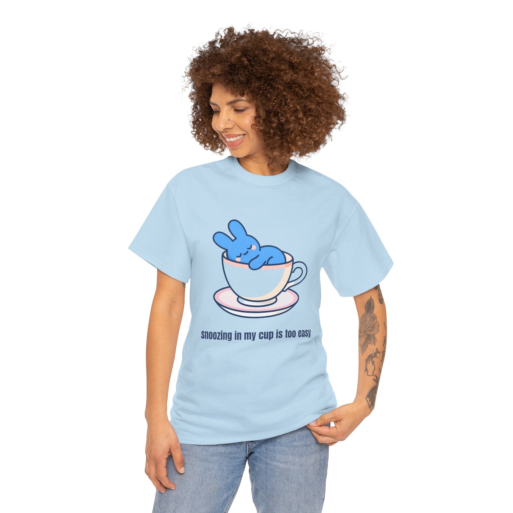Cute Bunny Tea Tee — "Snoozing in My Cup is Too Easy" Graphic T-Shirt - Steep Dreams – Why sit beside a cup when you can sleep IN one? 😴☕ Our little blue bunny has found the cosiest nap spot imaginable — and honestly, we're jealous. S